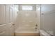 A tiled bathroom with a shower/tub combination at 2007 Wexford Way, Statesville, NC 28625