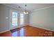 Bright dining area with beautiful hardwood floors and backyard views at 2007 Wexford Way, Statesville, NC 28625