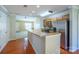 Stylish kitchen with stainless steel appliances, a breakfast bar, and open views to the living space at 2007 Wexford Way, Statesville, NC 28625