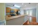 A view of the kitchen featuring stainless steel appliances and an extended breakfast bar at 2007 Wexford Way, Statesville, NC 28625