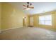 Cozy living room with carpet flooring, natural light, and seamless flow to the kitchen area at 2007 Wexford Way, Statesville, NC 28625