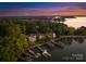 Beautiful aerial view of waterfront houses with private docks on a scenic lake at 21013 Island Forest Dr, Cornelius, NC 28031