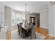 Elegant dining room with hardwood floors, natural light, and stylish chandelier at 21013 Island Forest Dr, Cornelius, NC 28031