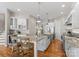 Well-appointed kitchen features granite counters, stainless steel appliances, and an island with seating at 21013 Island Forest Dr, Cornelius, NC 28031