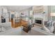 Bright and airy living room featuring hardwood floors, fireplace, and a modern open concept kitchen at 21013 Island Forest Dr, Cornelius, NC 28031