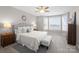 Serene main bedroom featuring a comfortable bed, neutral tones, and windows with water views at 21013 Island Forest Dr, Cornelius, NC 28031