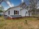 This backyard features a well manicured yard, covered deck area, and access to the homes basement at 211 9Th St, Belmont, NC 28012