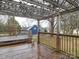 Backyard deck view with wooden railings and a view of another house at 211 9Th St, Belmont, NC 28012