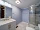 Updated bathroom with stylish vanity, framed mirror, and glass-enclosed shower at 211 9Th St, Belmont, NC 28012