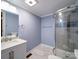 This bathroom features clean bright colors, a modern vanity and fixtures, and a new shower unit at 211 9Th St, Belmont, NC 28012