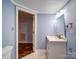 This bathroom features clean bright colors, a modern vanity and fixtures, and updated mirrors and lighting at 211 9Th St, Belmont, NC 28012