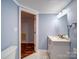 Updated bathroom with stylish vanity, framed mirror, and neutral paint at 211 9Th St, Belmont, NC 28012