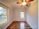 Bedroom with hardwood floors, ceiling fan, and views of the backyard at 211 9Th St, Belmont, NC 28012