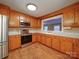 Bright kitchen with stainless steel appliances, ample cabinet space, and an opening to an adjacent room at 211 9Th St, Belmont, NC 28012