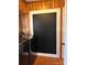 A functional laundry room boasts a large chalkboard wall for notes and a modern washer-dryer setup at 211 9Th St, Belmont, NC 28012
