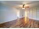 Open living room with beautiful wood-look floors and a large built-in shelving unit at 211 9Th St, Belmont, NC 28012