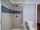 Updated bathroom with tiled shower featuring a glass enclosure and brushed nickel hardware at 211 9Th St, Belmont, NC 28012