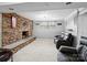 Finished basement with a stone fireplace, plush seating, and a cozy atmosphere at 2200 Peninsula Ave, Shelby, NC 28150