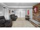 Cozy basement featuring a stone fireplace, comfortable couches, and neutral carpeting at 2200 Peninsula Ave, Shelby, NC 28150