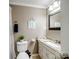Cozy bathroom featuring a vanity, a framed mirror, and a shower with white curtain at 2200 Peninsula Ave, Shelby, NC 28150