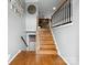 Inviting foyer with hardwood floors, staircase, and views into the kitchen at 2200 Peninsula Ave, Shelby, NC 28150