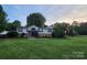 Charming two-story home featuring well-manicured lawn, and decorative stone accents at 2200 Peninsula Ave, Shelby, NC 28150