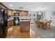 Traditional kitchen with granite countertops, an island, and wood cabinets at 2200 Peninsula Ave, Shelby, NC 28150