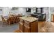 Open-concept layout with kitchen island, adjacent dining, and relaxing living area at 2200 Peninsula Ave, Shelby, NC 28150