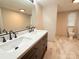 Bathroom featuring double sinks with modern fixtures and a large mirror at 288 John L Hudson Sr Rd, Lancaster, SC 29720