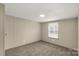 Comfortable bedroom features neutral carpet, a window for natural light, and a closet at 288 John L Hudson Sr Rd, Lancaster, SC 29720