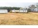Exterior view of a single-story home with a large front yard and wooden porch at 288 John L Hudson Sr Rd, Lancaster, SC 29720