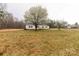 Charming single-story home with a wide front yard, mature trees, and a wooden porch at 288 John L Hudson Sr Rd, Lancaster, SC 29720