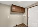 Functional laundry room with overhead cabinets and a convenient exterior door at 288 John L Hudson Sr Rd, Lancaster, SC 29720