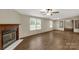 Cozy living room featuring a fireplace, hardwood floors and two windows at 288 John L Hudson Sr Rd, Lancaster, SC 29720
