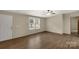 Bright living room with wood floors, a large window, and a ceiling fan at 288 John L Hudson Sr Rd, Lancaster, SC 29720
