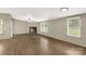 Open living room featuring a fireplace and multiple windows for natural light at 288 John L Hudson Sr Rd, Lancaster, SC 29720