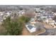 Aerial view of a residential neighborhood featuring well-maintained homes and mature trees at 303 Cupped Oak Ct, Charlotte, NC 28213