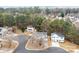 Scenic aerial view capturing the homes nestled among lush trees and landscaping at 303 Cupped Oak Ct, Charlotte, NC 28213
