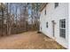 View of the backyard and the side of the house at 303 Cupped Oak Ct, Charlotte, NC 28213