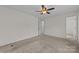 Spacious bedroom featuring a ceiling fan and neutral walls at 303 Cupped Oak Ct, Charlotte, NC 28213