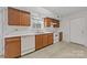 Functional kitchen featuring wooden cabinets and white appliances at 303 Cupped Oak Ct, Charlotte, NC 28213