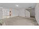 Spacious Living room leading to a kitchen and stairs at 303 Cupped Oak Ct, Charlotte, NC 28213