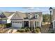 Aerial view of home with a manicured lawn, mature trees, and a well-maintained yard at 305 Kentmere Ln, Clover, SC 29710