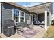 Relaxing back porch area with outdoor seating and a grill, perfect for enjoying the outdoors at 305 Kentmere Ln, Clover, SC 29710
