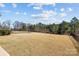 Expansive grassy backyard with a full-perimeter fence, offering privacy and space at 305 Kentmere Ln, Clover, SC 29710