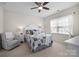 Neutral bedroom with ceiling fan, window with blinds, and chair at 305 Kentmere Ln, Clover, SC 29710