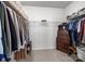 Spacious walk-in closet with installed organizers and shelving with an antique dresser for storage at 305 Kentmere Ln, Clover, SC 29710