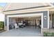 Well-organized garage features epoxy floors, storage, and a golf cart, blending function with style at 305 Kentmere Ln, Clover, SC 29710