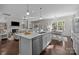 Bright, modern kitchen with stainless steel appliances and a large island at 305 Kentmere Ln, Clover, SC 29710