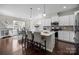 Bright, open kitchen with island, stainless steel appliances, and eat-in dining area at 305 Kentmere Ln, Clover, SC 29710